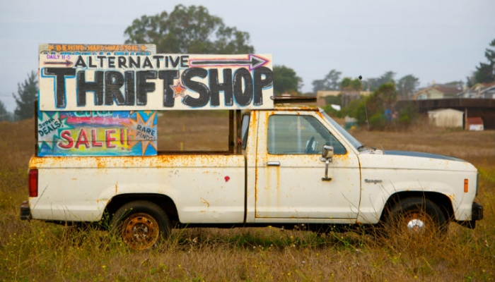 van with thrift shop sign